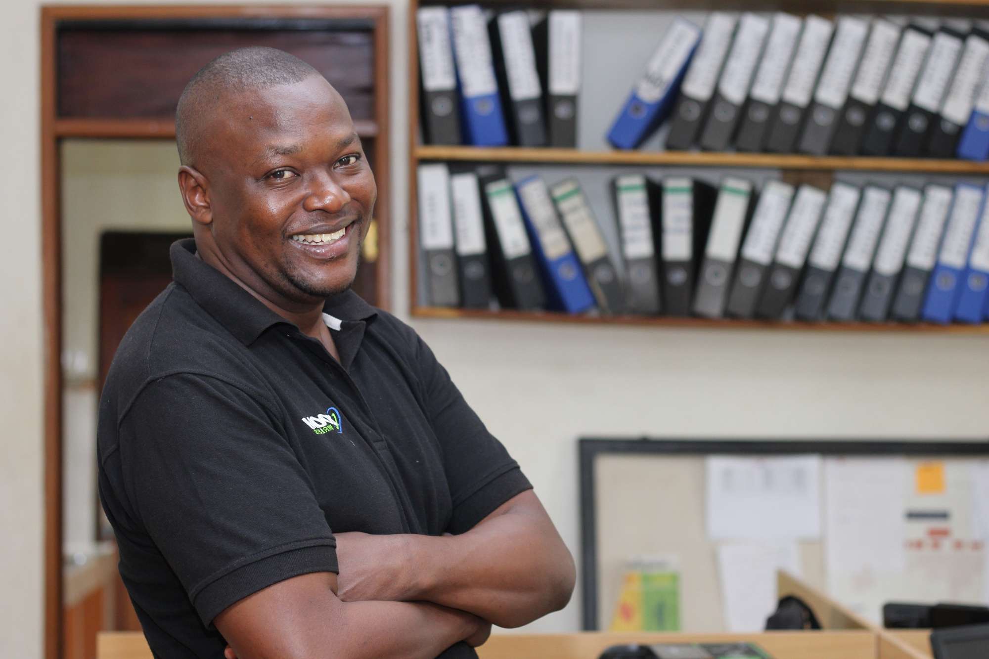 Loan client standing smiling